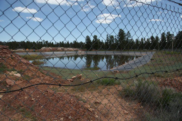 According to the Grand Canyon Trust, water filling the 1,475-foot mine shaft at Canyon Mine, if contaminated, could potentially flow through rock fissures and pollute the groundwater aquifer. Last April, water in this retention pond tested at 130 parts of dissolved uranium per billion, more than three times the federal drinking water standard.