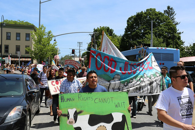 Victor Diaz leading the march on Ben & Jerry’s flagship scoopshop in 2015. (Photo: Jonathan Leavitt)