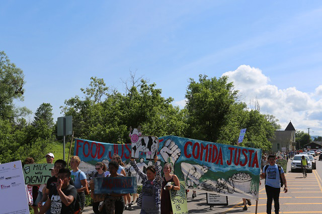 Several hundred Migrant Justice members and allies outside the Ben & Jerry’s factory. (Photo: Jonathan Leavitt)