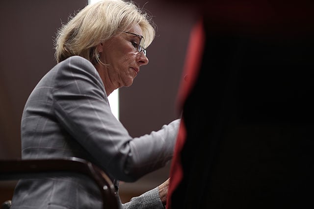 Education Secretary Betsy DeVos testifies before the Senate Appropriations Committee on Capitol Hill June 6, 2017 in Washington, DC. Under Trump and DeVos, the landscape has shifted dramatically for America's predatory for-profit colleges. (Photo: Win McNamee / Getty Images)
