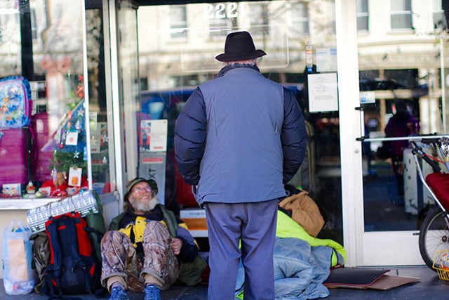 J.C. Orten makes his morning run serving the homeless in downtown Berkeley. He picks up their mail, gives medicines, and manages their money as their representative payee. The greatest gift you can give is a gift of self, he said. (Photo: Rucha Chitnis © The Oakland Institute)