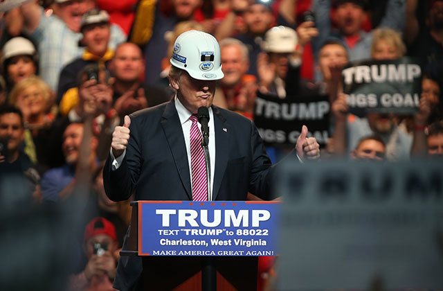 Then-presidential candidate Donald Trump models a hard hat during his rally at the Charleston Civic Center on May 5, 2016 in Charleston, West Virginia. It's time to give Trump's snake-oil-style energy salesmanship the attention it deserves. (Photo: Mark Lyons / Getty Images)