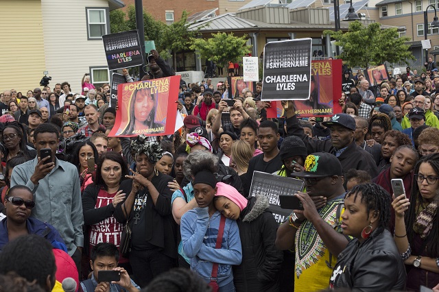 Attendees listen during a march and rally in honor of Charleena Lyles at the apartment building in which she was killed on June 20, 2017 in Seattle, Washington. Officers from the Seattle Police Department shot and killed Lyles, a pregnant mother of four, on June 18. (Photo by David Ryder/Getty Images)