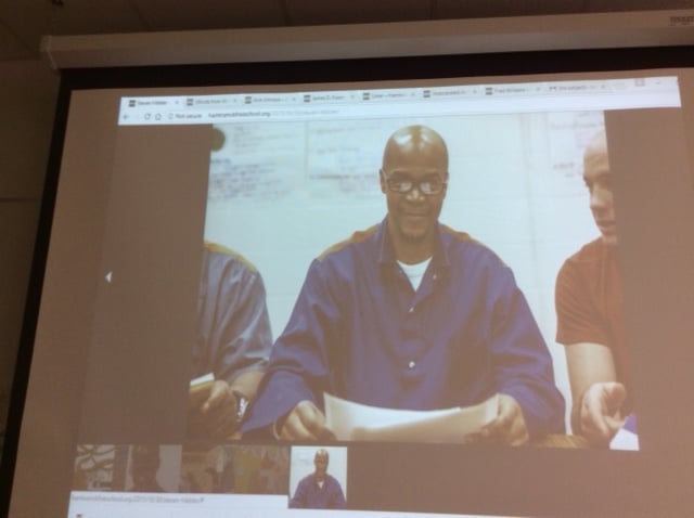Steven Hibbler, member of Writer's Block in Detroit's Hamtramck Free School in Macomb County Correctional Facility, reads his poetry on screen. Image courtesy of Jean Trounstine.