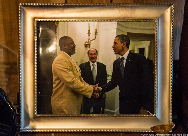 A photo of Hilton Kelley with President Obama on the wall of Kelley's recently flooded home in Port Arthur, Texas. (Photo: Julie Dermansky)