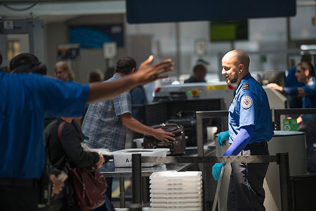 Travelers are screened by Transportation Security Administration (TSA) workers at a security check point at O'Hare Airport on June 2, 2015 in Chicago, Illinois. The Department of Homeland Security said that the acting head of the TSA would be replaced following a report that airport screeners failed to detect explosives and weapons in nearly all of the tests that an undercover team conducted at airports around the country. (Photo: Scott Olson / Getty Images)