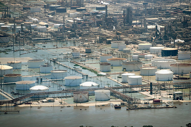 Floodwater left in the wake of Hurricane and Tropical Storm Harvey begins to recede in an industrial area on August 31, 2017 near Houston, Texas. The South Texas coast where Harvey hit ... is just littered with hundreds of fossil fuel and industrial facilities that store large amounts of dangerous chemicals, says climate scientist Shaye Wolf. (Photo: Scott Olson / Getty Images)