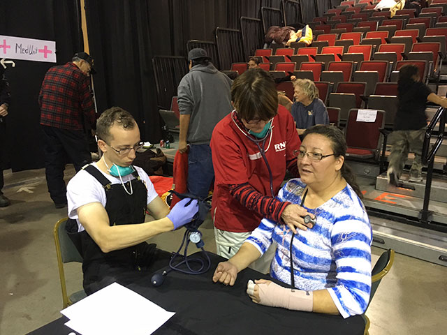 Dotty caring for patients in the Casino in Standing Rock, during the blizzard (most people from camp evacuated to the Casino during the blizzard). (Photo courtesy of National Nurses United)