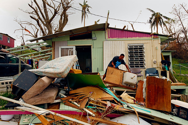 Jose Gonzalez has taken everything out of his home in Estancia Del Sol, outside of Rio Grande, after the hurricane destroyed it. Many people in the area have not received any aid one week after the hurricane Maria. The roof of their home is gone and they have very little to eat. (Photo: Carolyn Cole / Los Angeles Times via Getty Images)