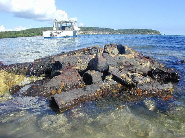 Recoil-less rifle cartridges on the north shore of the Island of Vieques, Puerto Rico. According to a recent study, some fish and shellfish from certain reefs surrounding Vieques contained elevated levels of metals like arsenic and selenium. (Photo: Courtesy of James Barton)