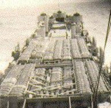 Archival picture of a ship loaded with munitions, awaiting scuttling out to sea. (Photo: Courtesy of the International Dialogue on Underwater Munitions / National Archives)