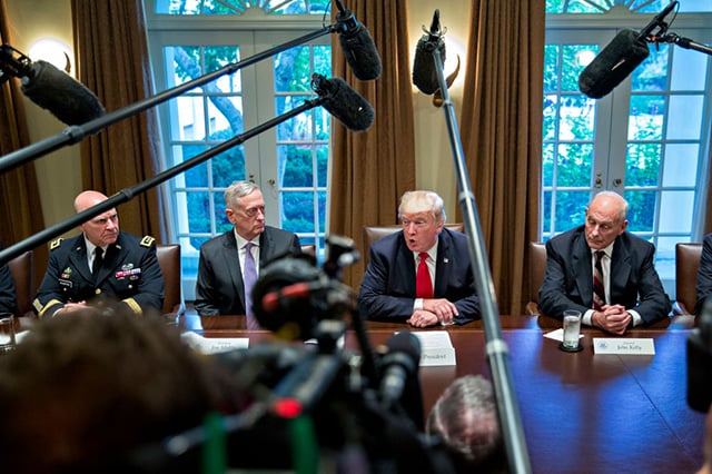 Donald Trump (center), national security advisor H.R. McMaster (left), White House chief of staff John Kelly (second left) and Defense Secretary Jim Mattis (right) attend a briefing with senior military leaders in the Cabinet Room of the White House October 5, 2017, in Washington, DC. (Photo: Andrew Harrer-Pool / Getty Images)