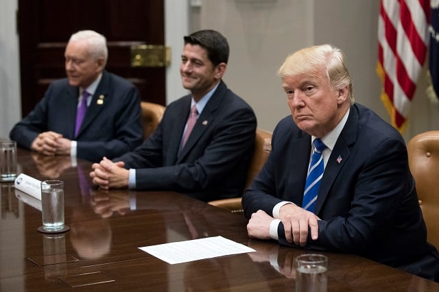 US President Donald Trump (R) with Speaker of the House Paul Ryan (C), Chairman of the Senate Finance Committee Orrin Hatch (L) and other members of congress and his administration regarding tax reform in the Roosevelt Room of the White House on September 5, 2017 in Washington, DC. (Photo by Shawn Thew-Pool/Getty Images)