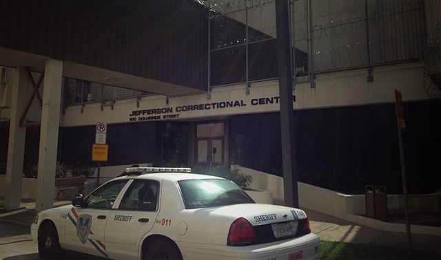 The Jefferson Parish Correctional Center in Gretna, Louisiana replaced in-person visitation through a glass partition with video calls this week. Three suicides have occurred at the jail since August, raising concerns about the mental health of its prisoners. (Photo: Mike Ludwig; Edited: LW / TO)