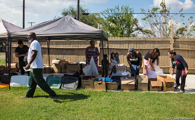 Hilton Kelley walks by a makeshift relief center set up on the driveway of his restaurant Kelley’s Kitchen in downtown Port Arthur. Organizations from across the country have been sending Kelley supplies, which are available to anyone in need. (Photo: Julie Dermansky)