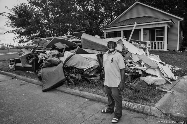 Percy Blacke in front of Hurricane Harvey debris he removed from his house in Port Arthur, Texas, across from the Prince Hall Village Apartments on September 20, 2017. (Photo: Julie Dermansky)