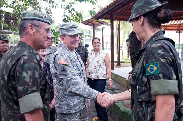 Army Gen. Martin E. Dempsey, chairman of the Joint Chiefs of Staff, thanks a Brazilian soldier for assisting with his tour of the jungle training center in Manaus, Brazil, on March 28, 2012. Dempsey was there to visit the jungle training center which borders several different countries in the Amazon Basin. (DOD photo by US Army Staff Sgt. Sun L. Vega, Joint Staff)