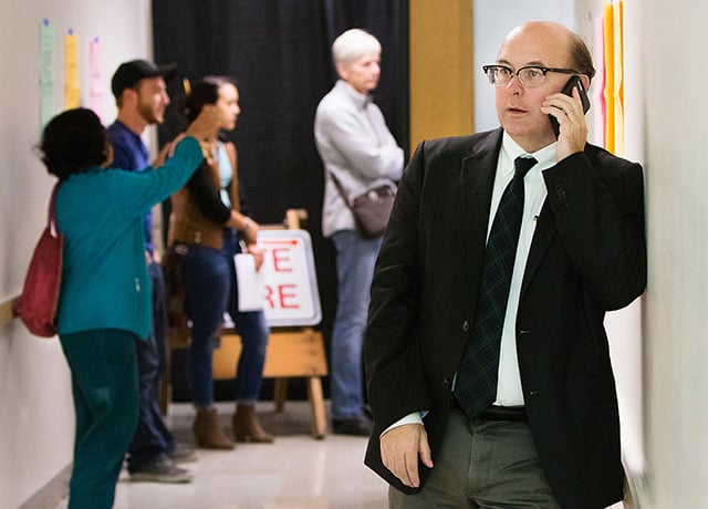 Maine Secretary of State Matthew Dunlap fields a phone call during one of several election day stops, to see how the polling process is going, at the Merrill Auditorioun Rehearsal Hall voting location in Portland on Tuesday, November 8, 2016. Dunlap filed a suit against the Presidential Advisory Commission on Election Integrity for allegedly violating the Federal Advisory Commission Act. (Photo: Carl D. Walsh / Portland Press Herald via Getty Images)