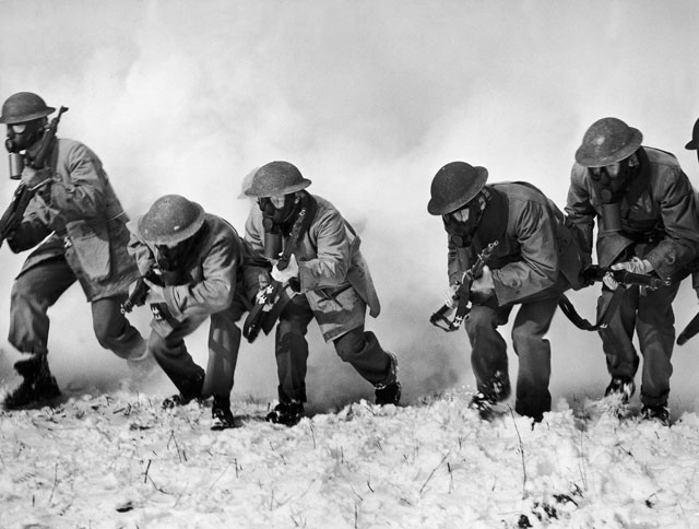 Soldiers are shown racing through a smoke screen, to which tear gas had been added by surprise to test their powers at detecting its presence, during a drill at Fort Dix, New Jersey, in 1941. They also were given a sniff of four world war gases — phosgene, chloropicrin, mustard and lewisite. (Photo: Keystone-France / Gamma-Keystone via Getty Images)