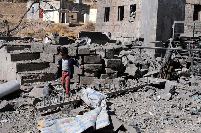 A boy walks on rubble of Yemen's State Satellite Television Station after it was targeted by airstrikes of the Saudi-led coalition on December 09, 2017 in Sana'a, Yemen. At least four journalists were killed by airstrikes hit the Yemen's State Satellite Television Station. (Photo: Mohammed Hamoud / Getty Images)