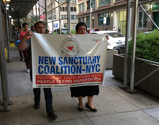 Collaborators carry ice from Judson Church through the streets of the Greenwich Village to the ICE facility. (Photo: Lindsay Holcomb)