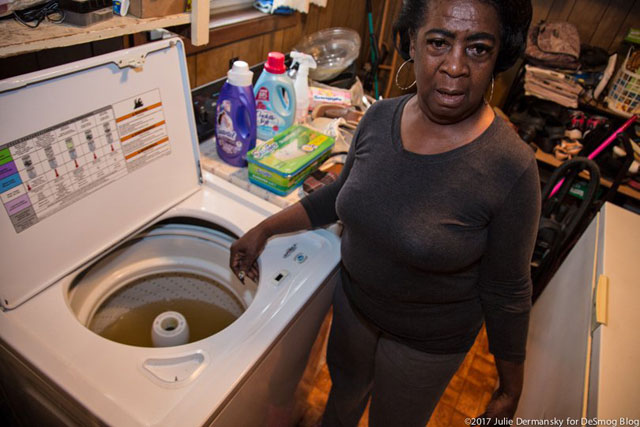 St. Joseph resident Rudy Shorts fills her washing machine to see if the water is usable and opts not to use it, waiting for the contaminated municipal pipes to be replaced. 