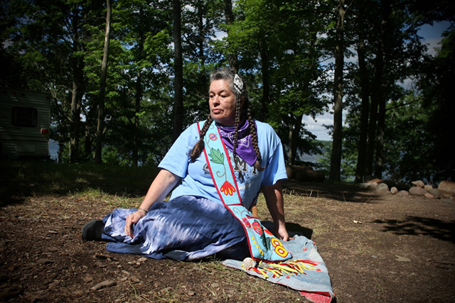 The power of Ojibwe women as represented by Babette Sandman, who is White Earth Ojibwe from Minnesota. Sandman, or Makada Miigwan (