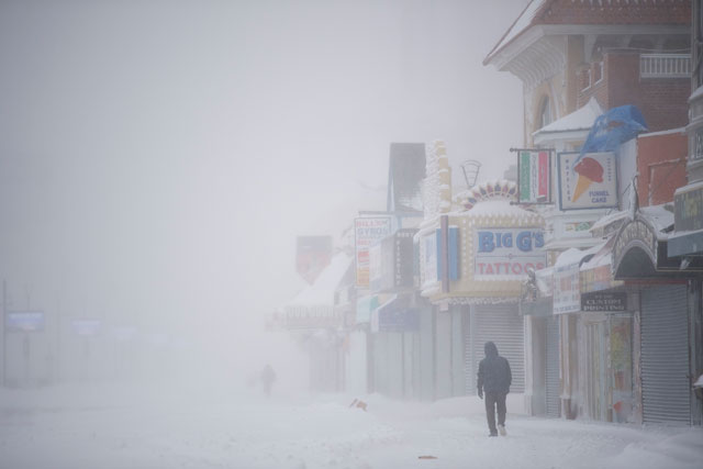 A man walks on the snow covered boardwalk during a snow storm on January 4, 2018 in Atlantic City, New Jersey. A 'bomb cyclone' winter storm has caused every East Coast state, from Maine to Florida, to declare at least one weather advisory, winter storm watch, winter storm warning or blizzard warning. (Photo: Mark Makela / Getty Images)