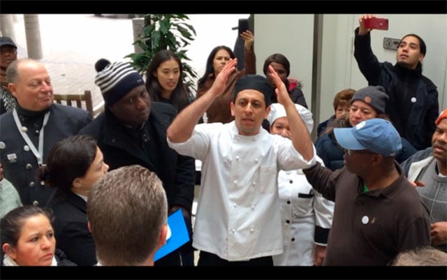 Stamford Hilton cook Irwin Martinez alongside coworkers and Hyatt workers informs hotel management of their intent to unionize. (Photo: Unite Here Local 217)