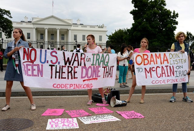 Washington DC, Monday evening August 20, 2014. Around twenty social justice activists associated with Code Pink and other peace groups rallied in front of The White House to protest the renewed bombing of Iraq. The Obama administration claims that the bombing and increasing presence of US troops there is a necessary response to the virtual collapse of the US puppet government in large areas of the country and the capitulation of much of the Iraqi army to brutal Sunni Isis forces.