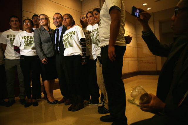 Rep. Luis Gutierrez and Rep. Kyrsten Sinema pose for photos with immigration reform activists after a discussion on immigration reform October 23, 2013 on Capitol Hill in Washington, DC. With the fate of DACA up in the air, Democrats have been relatively silent on the plight of nearly 10 million other undocumented immigrants in the country, further reinforcing the 