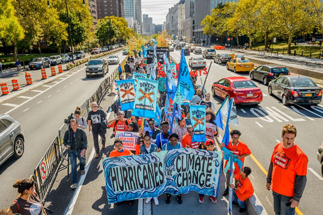 Thousands of New Yorkers came together for the #Sandy5 march on October 28, 2017, to commemorate the fifth anniversary of Superstorm Sandy. Participants demanded powerful climate action from New York's elected officials. (Photo: Erik McGregor / Pacific Press / LightRocket via Getty Images)