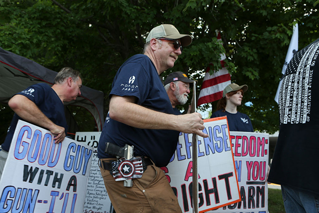 Pro gun owners counter-protest in front of the National Rifle Association headquarters in Fairfax, Virginia, during a rally organized by Women's March to denounce the NRAs endorsement of violence against communities of color on July 14, 2017. (Photo: Oliver Contreras / For The Washington Post via Getty Images)
