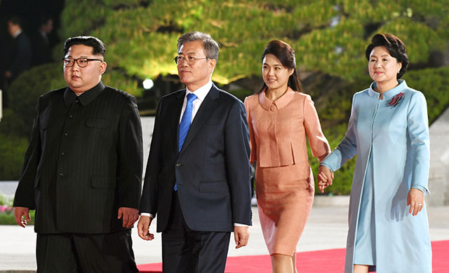 North Korea's leader Kim Jong Un and his wife Ri Sol Ju walk with South Korea's President Moon Jae-in and his wife Kim Jung-sook during a farewell ceremony at the end of their historic summit at the truce village of Panmunjom on April 27, 2018. (Photo: Inter Korean Press Corp / NurPhoto via Getty Images)