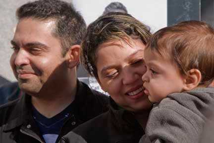 Reylla Denis Ferraz Da Silva, her husband Fabricio, and baby Enzo Gabriel. Reylla was picked up for deportation in San Francisco, and was released as a result of community protest. (Photo: David Bacon)