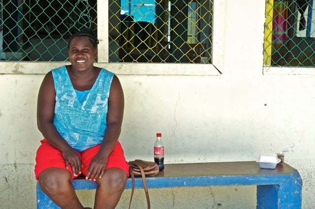 Clara Flores, the President of the Community Board of Triunfo de la Cruz sits in front of the town community hall where bribes were being offered to potential voters. (Photo: Andalusia Knoll)