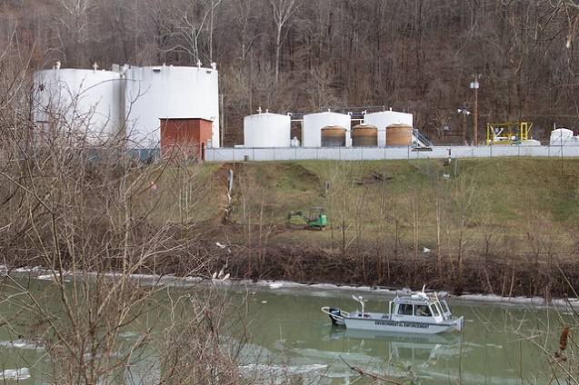 An environmental enforcement boat patrols in front of the chemical spill at Freedom Industries in Charleston, West Virginia. (Photo: <a href=
