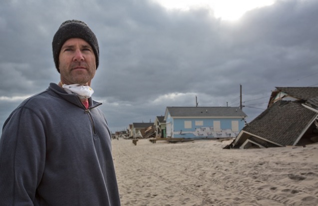 Michael Brune, president of the Sierra Club, checks out damage caused by Superstorm Sandy in Ocean Beach, New Jersey. (Photo: ©2013 Julie Dermansky)