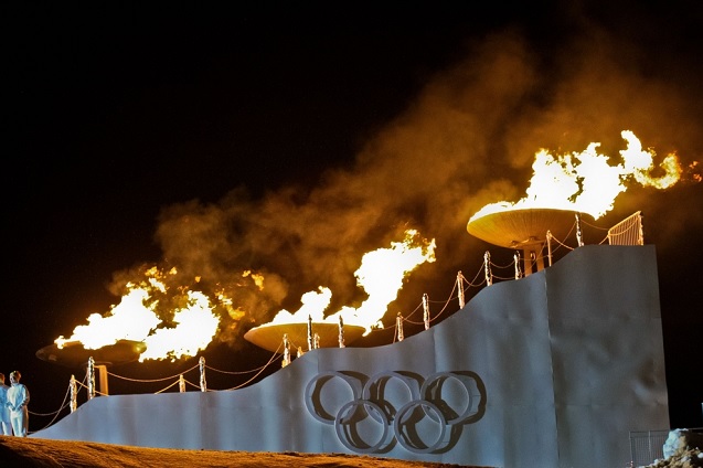 The Olympic fire is burning during the opening ceremony at the Bergisel stadium on January 13, 2012 in Innsbruck, Austria. (Photo <a href=