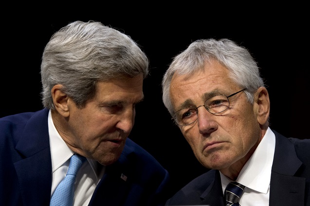 Secretary of State John Kerry confers with Secretary of Defense Chuck Hagel during testimony on US military intervention in Syria before the Senate Foreign Relations Committee at the Senate Hart Office Building in Washington, DC, on September 3, 2013. (Photo: <a href=
