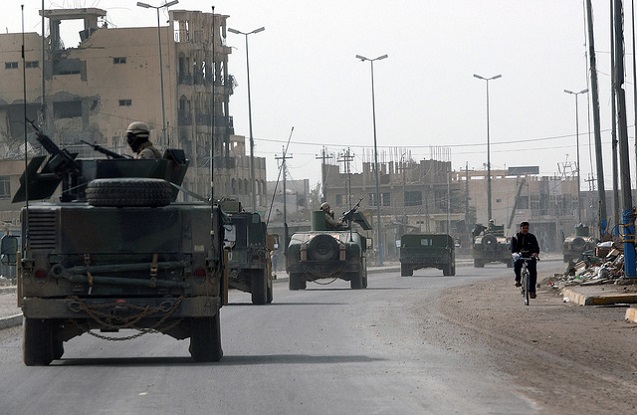 Fallujah, Iraq, January 29, 2005 - US Navy Seabees assigned to Naval Mobile Construction Battalion Twenty Three (NMCB 23) patrol the streets of Fallujah, one day prior to Iraq’s historic democratic elections. (Photo: <a href=