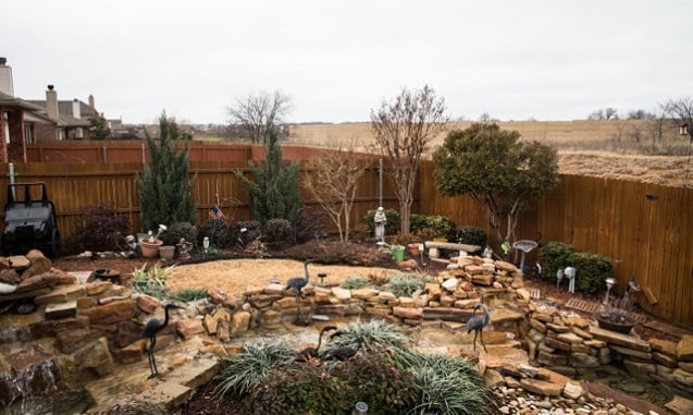 Debbie Ingram's backyard with view of a temporary wall at the EagleRidge fracking site. (Photo: ©2014 Julie Dermansky)