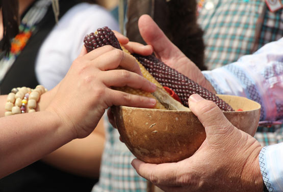 Participants exchange gifts at the opening ceremony, welcoming visitors to Piscataway traditional territory.