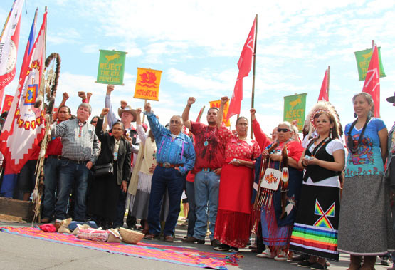 Indigenous members of the Cowboy Indian Alliance demonstrate in front of the U.S. Capitol.