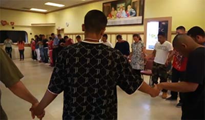 Xavier participates in a ceremony at his church. (Photo: Jean Melesaine of Silicon Valley De-Bug)