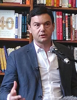 French economist Thomas Piketty at the reading for his book Capital in the Twenty-First Century, on April 18, 2014 at the Harvard Book Store in Cambridge, Massachusetts. (Image <a href=