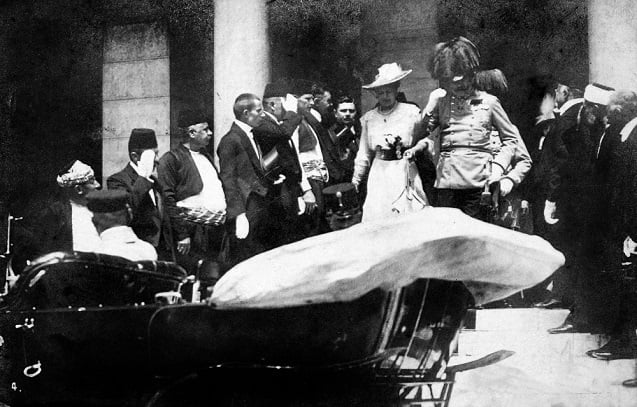 Archduke Franz Ferdinand and his wife Sophie leave the Sarajevo Guildhall after reading a speech on June 28, 1914. They were assassinated five minutes later. (Image <a href=