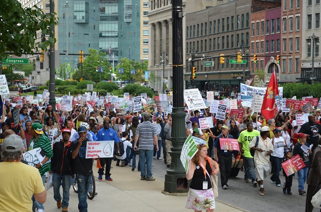 “When our water is under attack, what are we going to do? Stand up, fight back” hundreds of people in downtown Detroit explained, also imploring, “Tell me what democracy looks like,” and responding, “This is what democracy looks like.” (Photo: James Anderson)