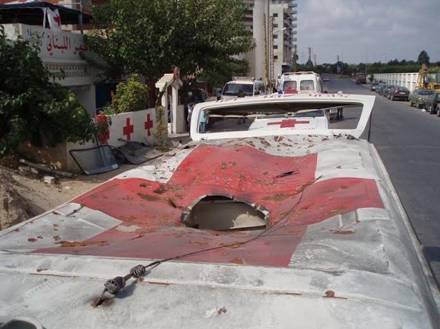 Lebanese Red Crescent workers and their ambulances attacked by the IDF, July 2006. (Photo: Dahr Jamail)