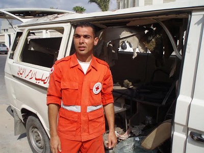 Lebanese Red Crescent workers and their ambulances attacked by the IDF, July 2006. (Photo: Dahr Jamail)